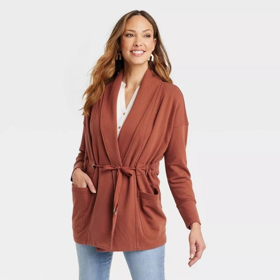 model wearing the brown wrap sweater