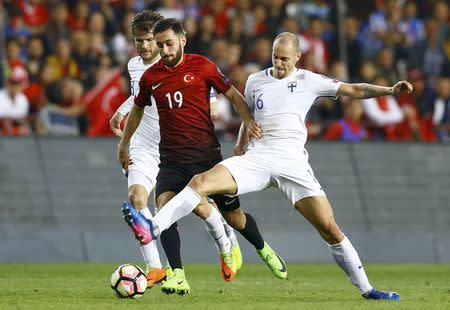 Football Soccer - Turkey v Finland - 2018 World Cup Qualifying European Zone - Antalya arena, Antalya, Turkey - 24/3/17 Turkey's Yunus Malli and Finland's Sakari Mattila in action. REUTERS/Murad Sezer