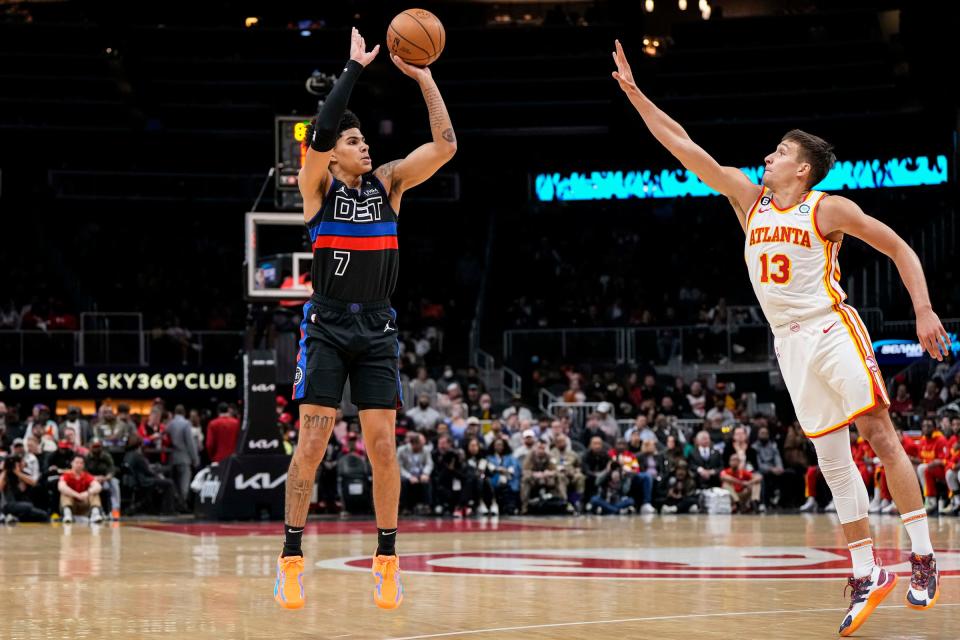 Detroit Pistons guard Killian Hayes (7) shoots over Atlanta Hawks guard Bogdan Bogdanovic (13) during the first half at State Farm Arena in Atlanta on Tuesday, March 21, 2023.