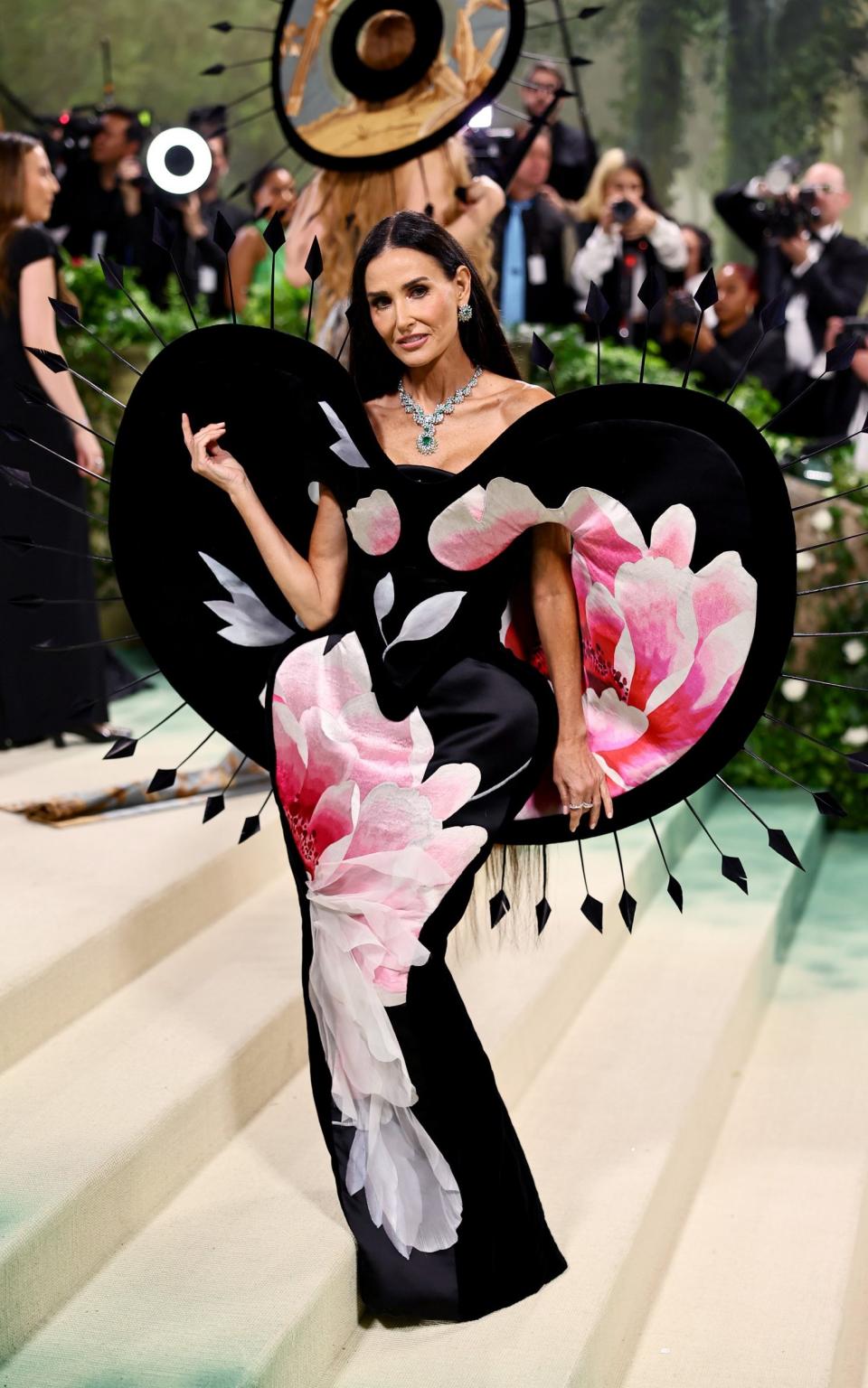 Demi Moore wears a floral embellished Harris Reed dress