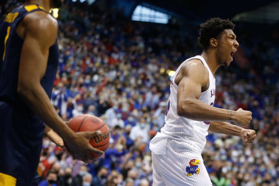 Kansas senior forward David McCormack (33) yells out after scoring against West Virginia during the first half of Saturday's game inside Allen Fieldhouse.