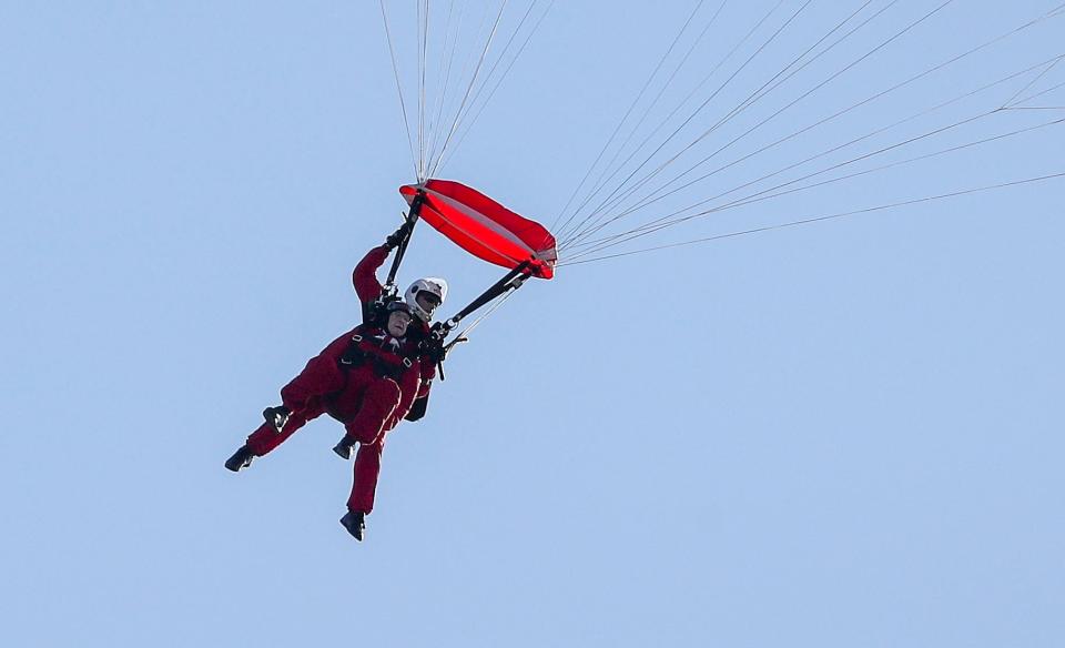 Sandy Cortmann, took to the skies in a daring tandem jump with The Red Devils British Army Parachute display team (PA)