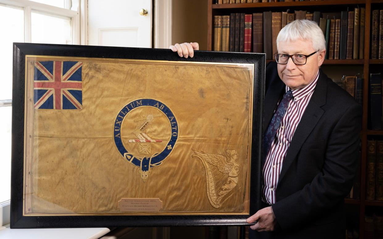 Professor Dominic Tweddle, director general of the National Museum of the Royal Navy, with the Kellett Flag - Geoff Pugh