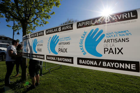 Youths prepare a banner on the eve of a demonstration to mark the handover of arms and explosives by civilian middlemen collected from the Basque militant separatist group ETA, in Bayonne, France, April 7, 2017. Banner reads, "Artisans of Peace". REUTERS/Regis Duvignau