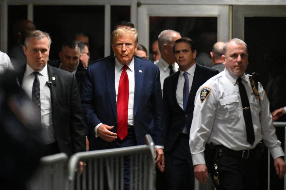Donald Trump appears inside Manhattan criminal court for a pretrial hearing in his hush money case on 15 February (AFP via Getty Images)