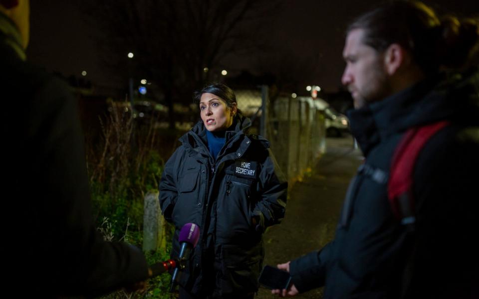 Home Secretary Priti Patel accompanied Immigration Enforcement Officers on an early morning arrest in north London of a suspected suspected of having a significant financial role in an organised crime group linked to people smuggling activity - Heathcliff O'Malley