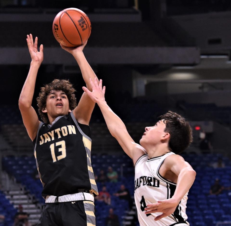 Jayton's Sean Stanaland (13) shoots over Graford's McKennon Lemley. Graford beat the Jaybirds 49-44 in overtime in the Class 1A state title game Saturday, March 11, 2023, at the Alamodome in San Antonio.