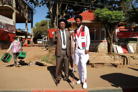 Magarsa Kanaa (L), a 28-year-old teacher and local leader of Oromo youths, poses for a portrait with Habtamu Bulcha, 75, a local elder as they prepare for an Oromo Liberation Front's (OLF) rally in Woliso, Oromia region, Ethiopia, October 21, 2018. REUTERS/Tiksa Negeri