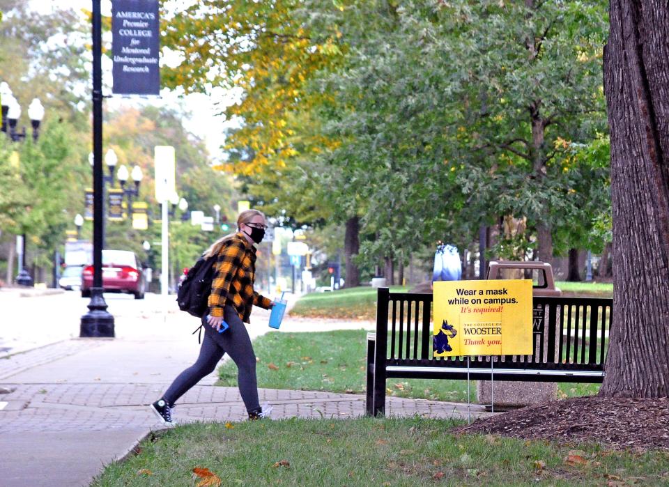 The College of Wooster campus has numerous signs telling everyone to wear masks when they are crossing campus due to recent outbreaks of COVID-19.