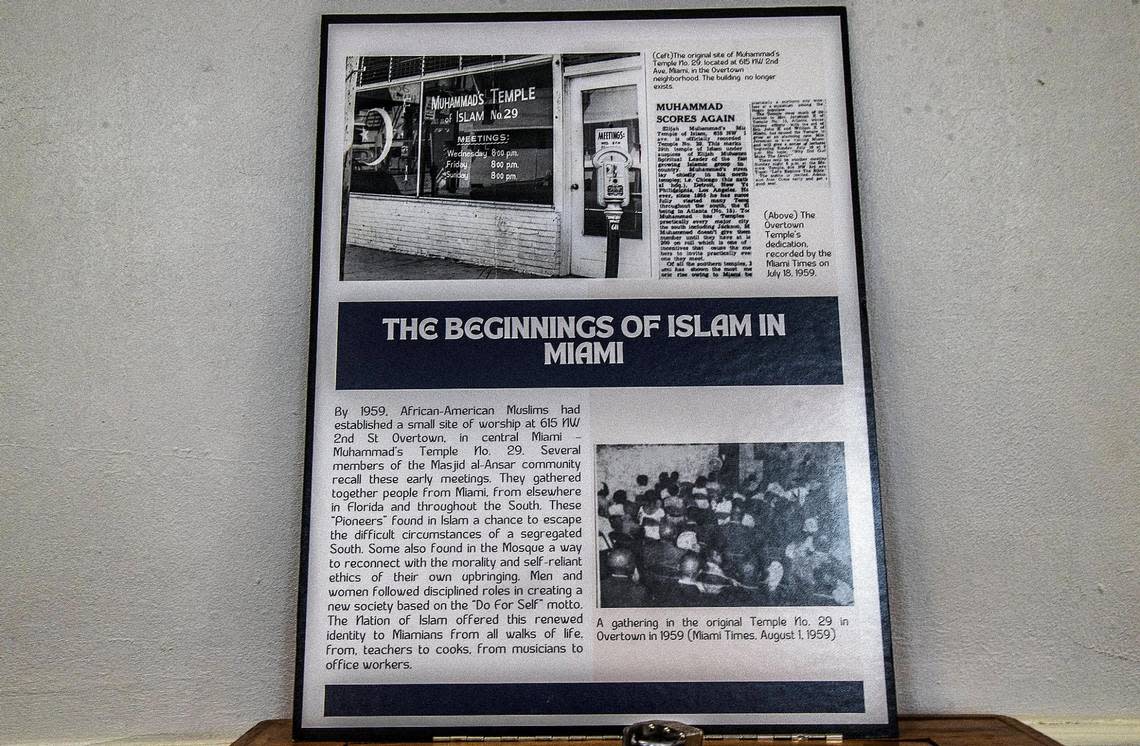 A poster including paper clippings detailing the beginning of Islam in Miami are on display at Masjid Al-Ansar during the Ramadan open house on Thursday, April 6, 2023.. Masjid Al-Ansar is the oldest mosque in Florida.