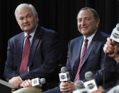 FILE - In this Jan. 24, 2015, file photo, NHL Player's Association executive director Donald Fehr, left, and NHL Commissioner Gary Bettman are shown during a news conference at Nationwide Arena in Columbus, Ohio. The NHL is one step closer to returning. Commissioner Gary Bettman unveiled a 24-team straight to playoffs format the league will use if it can clear the other hurdles to resume its season. The announcement comes on the heels of the league and NHLPA issuing an extensive series of protocols once players are allowed to return to their facilities. (AP Photo/Gene J. Puskar, File)