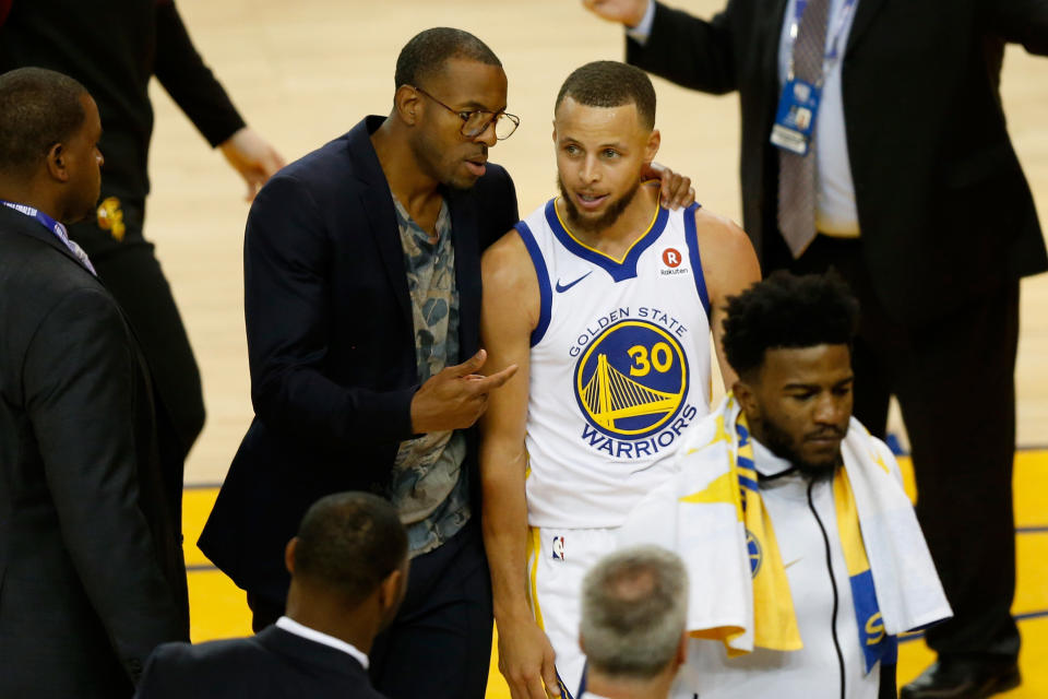 OAKLAND, CA - MAY 31:  Stephen Curry #30 of the Golden State Warriors talks with Andre Iguodala #9 during a timeout against the Cleveland Cavaliers in Game 1 of the 2018 NBA Finals at ORACLE Arena on May 31, 2018 in Oakland, California. NOTE TO USER: User expressly acknowledges and agrees that, by downloading and or using this photograph, User is consenting to the terms and conditions of the Getty Images License Agreement.  (Photo by Lachlan Cunningham/Getty Images)