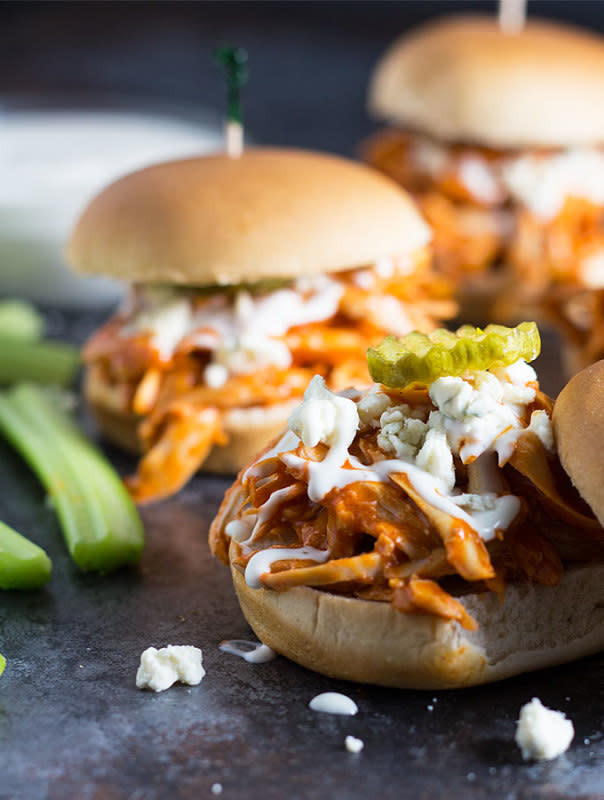 <p>These spicy little sliders are the perfect football food! Get the recipe <a href="http://theblondcook.com/2016/01/shredded-buffalo-chicken-sliders/" rel="nofollow noopener" target="_blank" data-ylk="slk:HERE;elm:context_link;itc:0;sec:content-canvas" class="link "><strong>HERE</strong></a>.</p>