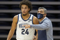 Villanova head coach Jay Wright talks with forward Jeremiah Robinson-Earl (24) during the first half of an NCAA college basketball game against Seton Hall, Tuesday, Jan. 19, 2021, in Villanova, Pa. (AP Photo/Laurence Kesterson)