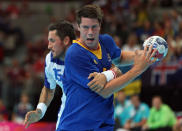 LONDON, ENGLAND - AUGUST 02: Kim Andersson #5 of Sweden is defended by Alexander Petersson #15 of Iceland in the Men's Preliminaries Group A match between Sweden and Iceland on Day 6 of the London 2012 Olympic Games at The Copper Box on August 2, 2012 in London, England. (Photo by Jeff Gross/Getty Images)