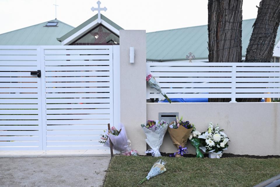 Flowers laid outside the Christ The Good Shepherd Church after the bishop was stabbed duirng a service on Monday (REUTERS)