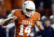 David Ash #14 of the Texas Longhorns celebrates a touchdown against the West Virginia Mountaineers at Darrell K Royal-Texas Memorial Stadium on October 6, 2012 in Austin, Texas. (Photo by Ronald Martinez/Getty Images)