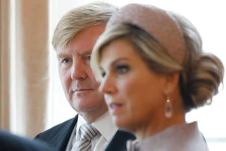 King Willem-Alexander and Queen Maxima of the Netherlands, wait to be greeted by Britain's Prince Charles, and Camilla, Duchess of Cornwall at the Dutch Ambassador's Residence at the start of a state visit, in London, Britain October 23, 2018. Tolga Akmen/Pool via REUTERS