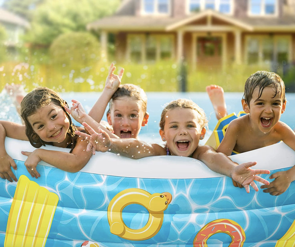 four children in blue outside plastic Self Inflatable Swimming Pool (Photo via Amazon)