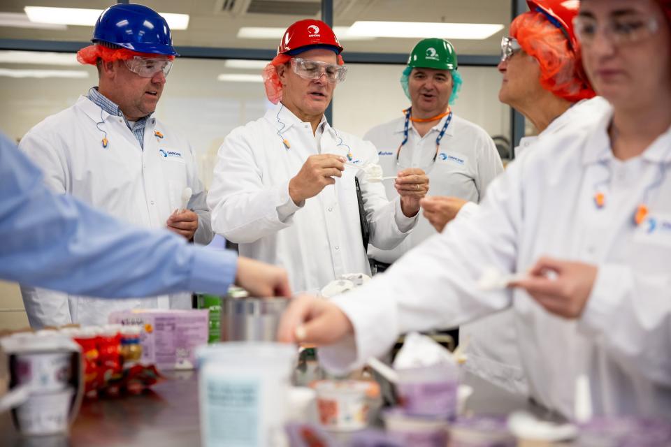 Salt Lake County Councilman Dave Alvord, left, and Rep. Ken Ivory, R-West Jordan, sample yogurt at the Danone North America facility in West Jordan on Thursday, Sept. 7, 2023. | Spenser Heaps, Deseret News