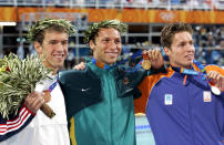 <p>Ian Thorpe (center), the 200-meter freestyle gold medal winner, is flanked by bronze medalist Michael Phelps and silver medalist Pieter van den Hoogenband (right) at the 2004 Summer Olympic Games in Athens. (Corey Sipkin/NY Daily News Archive via Getty Images)</p>