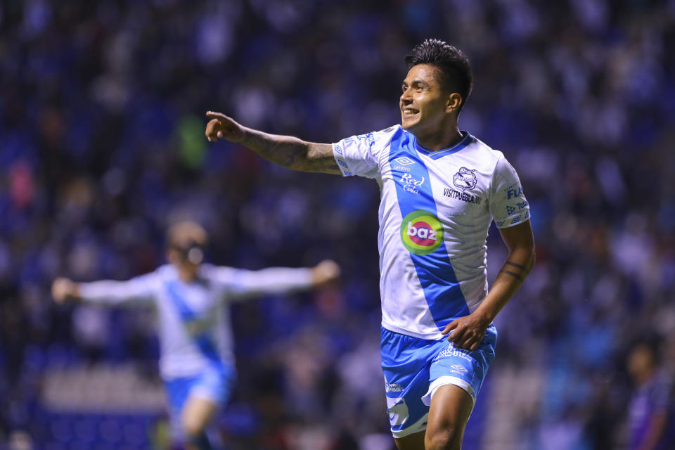 PUEBLA, MEXICO - OCTOBER 19: Dieter Villalpando of Puebla celebrates after scoring the second goal of his team during the 14th round match between Puebla and Mazatlan FC as part of the Torneo Grita Mexico A21 Liga MX at Cuauhtemoc Stadium on October 19, 2021 in Puebla, Mexico. (Photo by Agustin Cuevas/Getty Images)