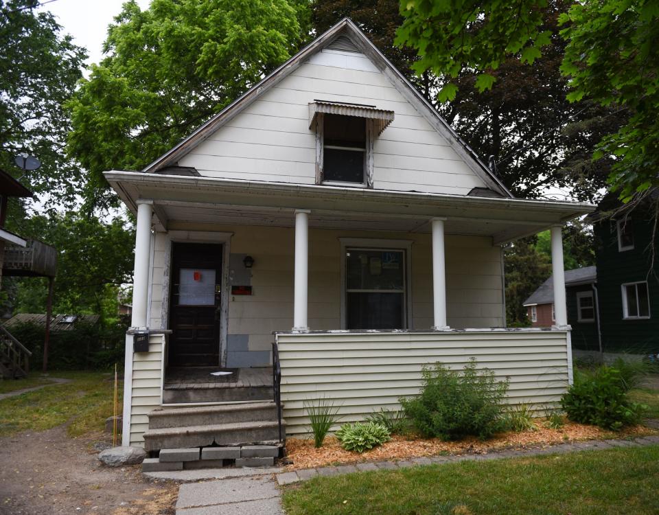 A home at 123 Isbell St. in Lansing's REO Town neighborhood is pictured Monday, June 12, 2023. It's the city's oldest red-tagged property, having been tagged since Oct. 31, 2003, and it's been a problem for city officials.