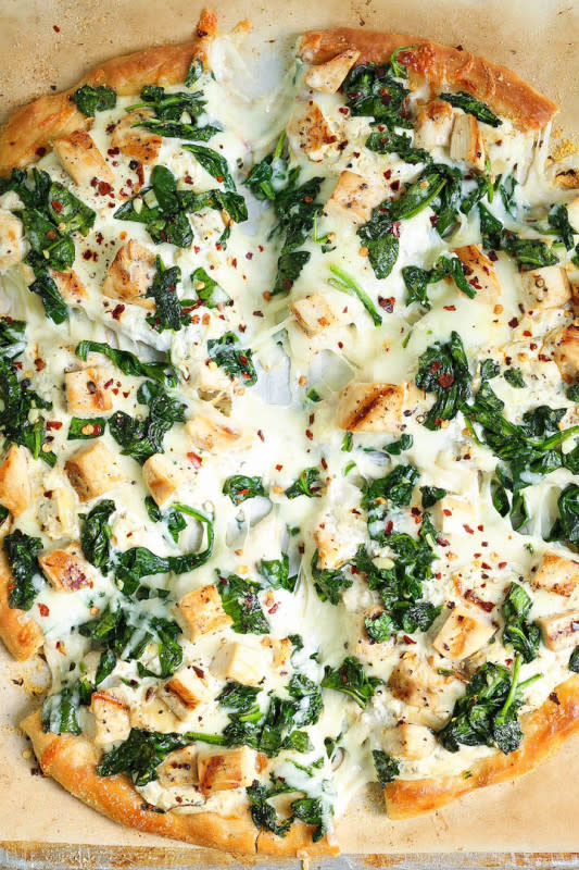 <p>Damn Delicious</p><p>So amazingly cheesy with just the right amount of garlic. You can save the leftover garlic for later use!</p><p><strong>Get the recipe: <a href="https://damndelicious.net/2017/05/19/roasted-garlic-chicken-and-spinach-white-pizza/" rel="nofollow noopener" target="_blank" data-ylk="slk:Roasted Garlic Chicken and Spinach White Pizza;elm:context_link;itc:0;sec:content-canvas" class="link ">Roasted Garlic Chicken and Spinach White Pizza</a></strong></p>