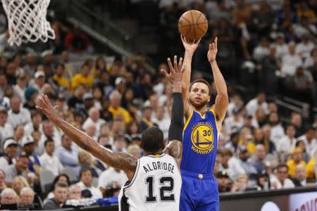 May 20, 2017; San Antonio, TX, USA; Golden State Warriors point guard Stephen Curry (30) shoots the ball over San Antonio Spurs power forward LaMarcus Aldridge (12) during the second half in game three of the Western conference finals of the NBA Playoffs at AT&T Center. Mandatory Credit: Soobum Im-USA TODAY Sports