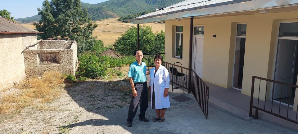 Nick Akgulian, left, with a village nurse after seeing patients together outside a village clinic in Nagorno Karabagh. The village sits on the current demarcation line with Azerbaijan and a site of occasional attacks.