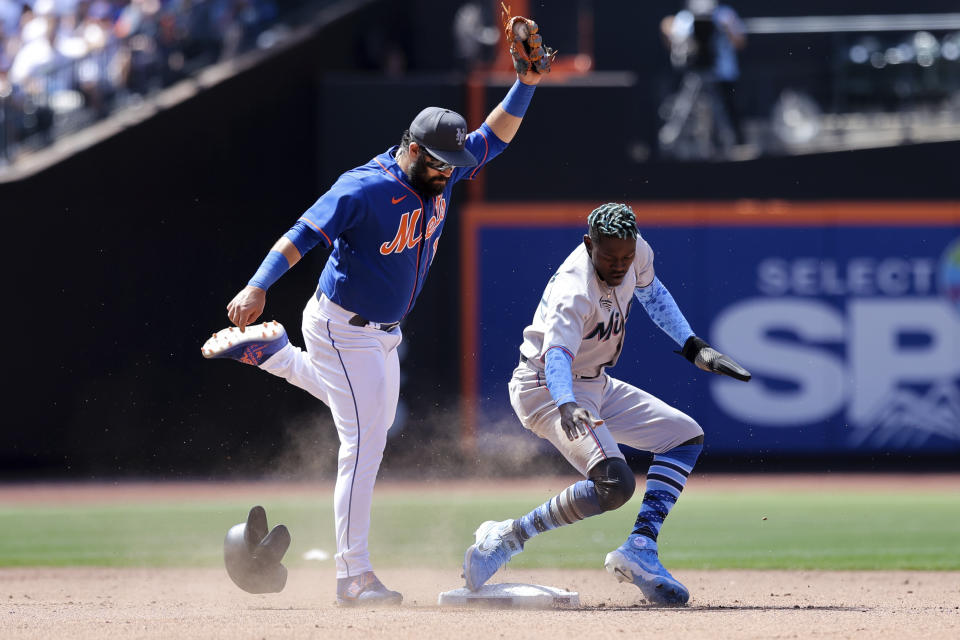 New York Mets shortstop Luis Guillorme, left, tags out Miami Marlins' Jazz Chisholm Jr. during the sixth inning of a baseball game, Sunday, June 19, 2022, in New York. (AP Photo/Jessie Alcheh)