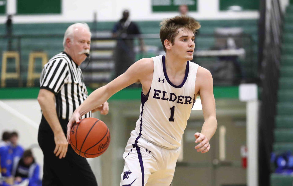 Elder guard Sean Keller drives to the basket during their game against Carmel during the Ohio Valley Hoops Classic, Saturday, Nov. 26, 2021.