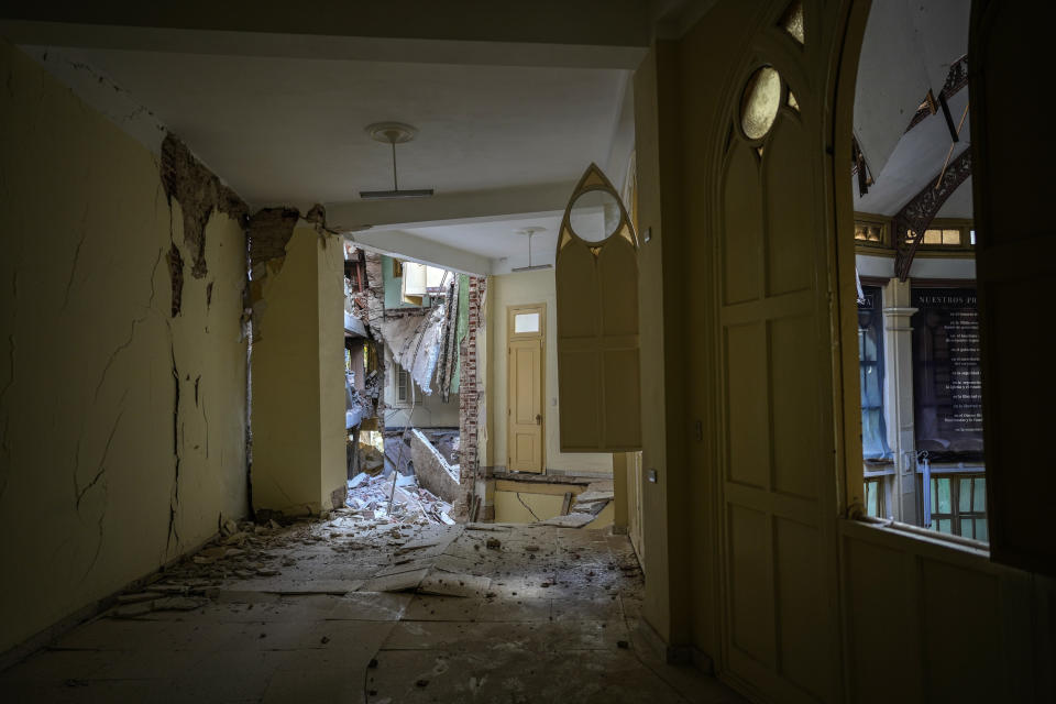 A view of a corridor inside the Calvary Baptist Church, damaged by an explosion that devastated the Hotel Saratoga, which sits next door, in Old Havana, Cuba, Wednesday, May 11, 2022. Since the building is registered as part of the country's historical heritage, repairs would be under the auspices of the Havana Historian's Office, which has overseen the restoration of much of Old Havana in recent decades. (AP Photo/Ramon Espinosa)