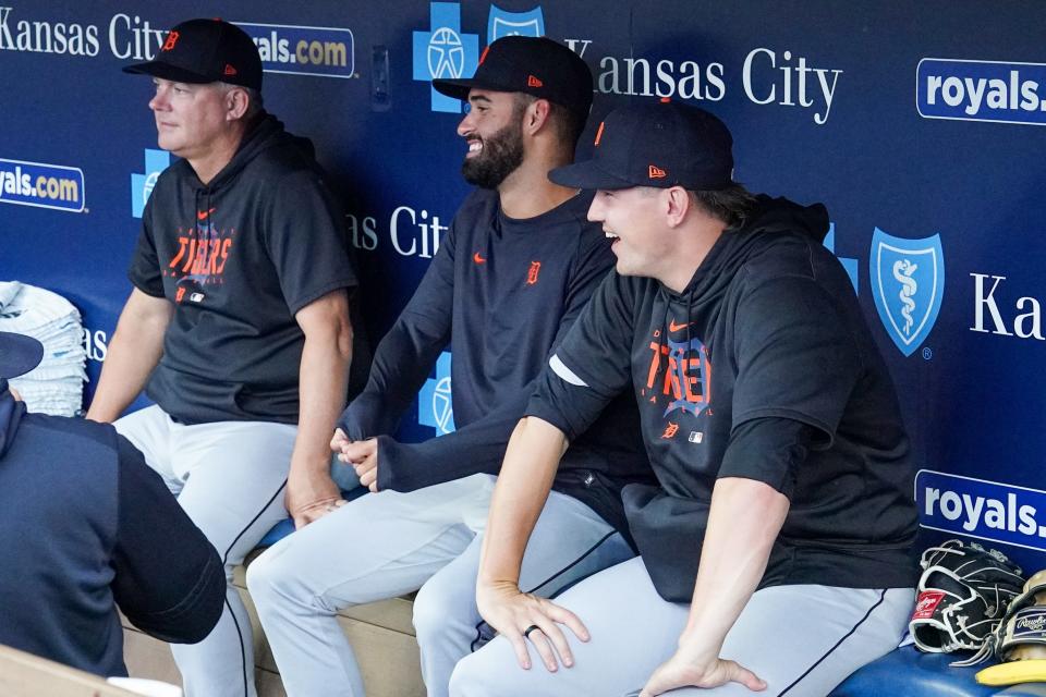 Detroit Tigers manager A.J. Hinch, left, outfielder Riley Greene, middle, and other players watch the tarp being removed from the field against the Kansas City Royals prior to a game at Kauffman Stadium in Kansas City, Missouri, on Tuesday, July 18, 2023.