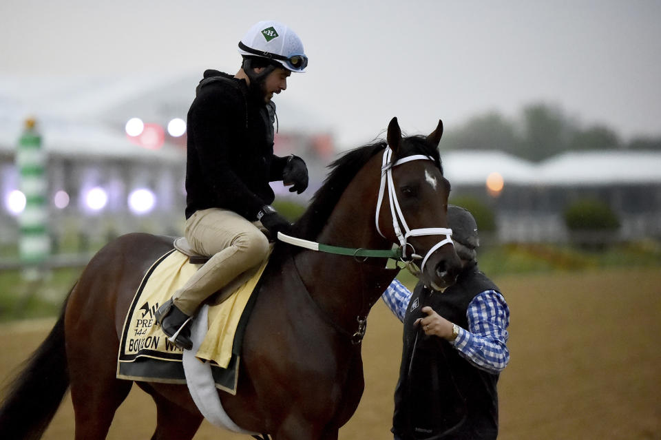 Preakness Stakes entrant Bourbon War is led off the track after exercising, Thursday, May 16, 2019, at Pimlico Race Course in Baltimore. The Preakness Stakes horse race is scheduled to take place Saturday, May 18. (AP Photo/Will Newton)