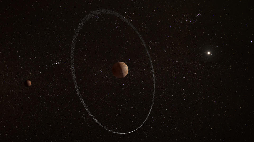 An artist’s impression of the dwarf planet Quaoar and its ring. Quaoar’s moon Weywot is shown on the left.