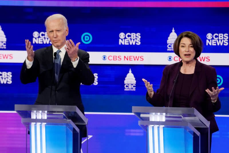 FILE PHOTO: Democratic 2020 U.S. presidential candidates Senator Sanders and former Vice President Biden participate in the tenth Democratic 2020 presidential debate in Charleston, South Carolina, U.S.