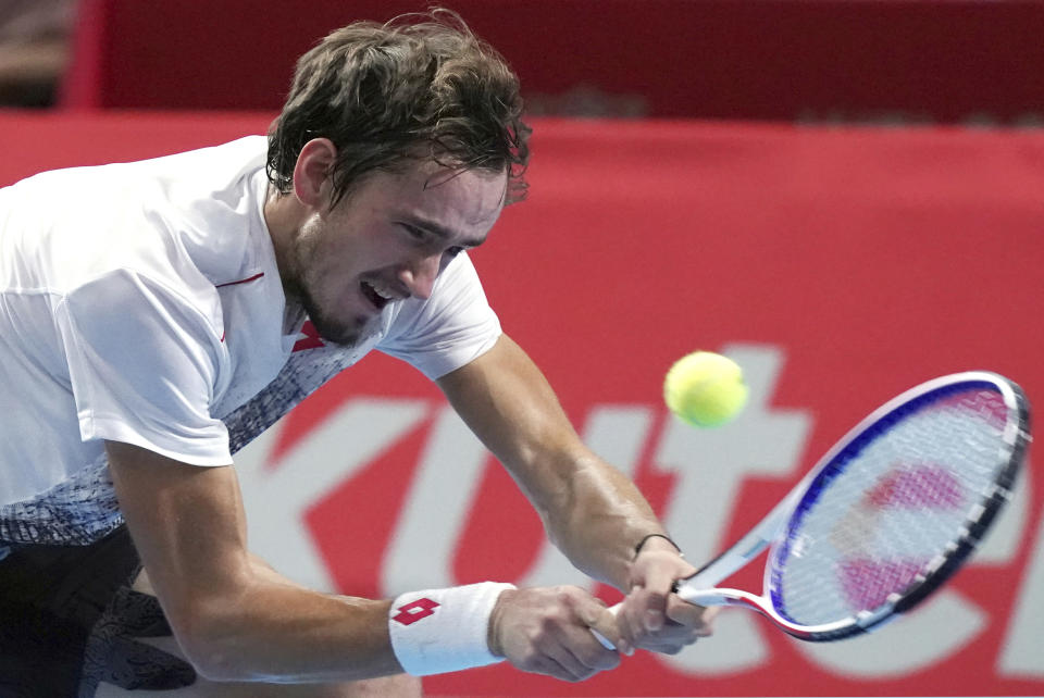 Daniil Medvedev of Russia returns a shot against Kei Nishikori of Japan during their single's final match at the Japan Open men's tennis tournament in Tokyo Sunday, Oct. 7, 2018. (AP Photo/Eugene Hoshiko)