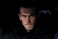 <p>Real Madrid’s Gareth Bale looks on from the bench </p>