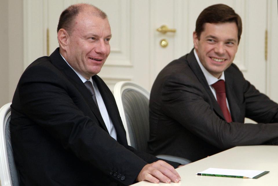 FILE In this Monday, Aug. 16, 2010 file photo Interros Investment Company President Vladimir Potanin, left, and Severstal's Chief Executive Alexei Mordashov, right, attend a meeting with then Russian President Dmitry Medvedev at the Bocharov Ruchei residence in the Black Sea resort of Sochi, southern Russia, . Russia’s most powerful businessmen have reason to be worried about the economic fallout from the takeover of Crimea and the sanctions imposed by the West as forecasts for Russia’s economy have dropped sharply and capital flight is soaring.(AP Photo/RIA-Novosti, Dmitry Astakhov, Presidential Press Service)