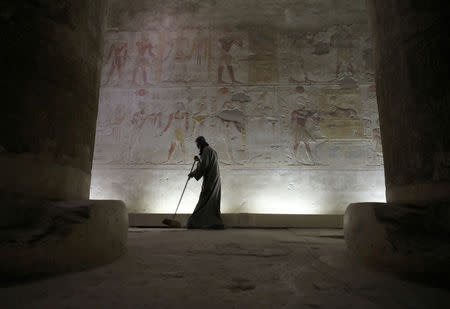 A worker sweeps the floow of Temple of Seti I, Abydos archeological site, Sohag, Egypt April 5, 2019. REUTERS/Mohamed Abd El Ghany