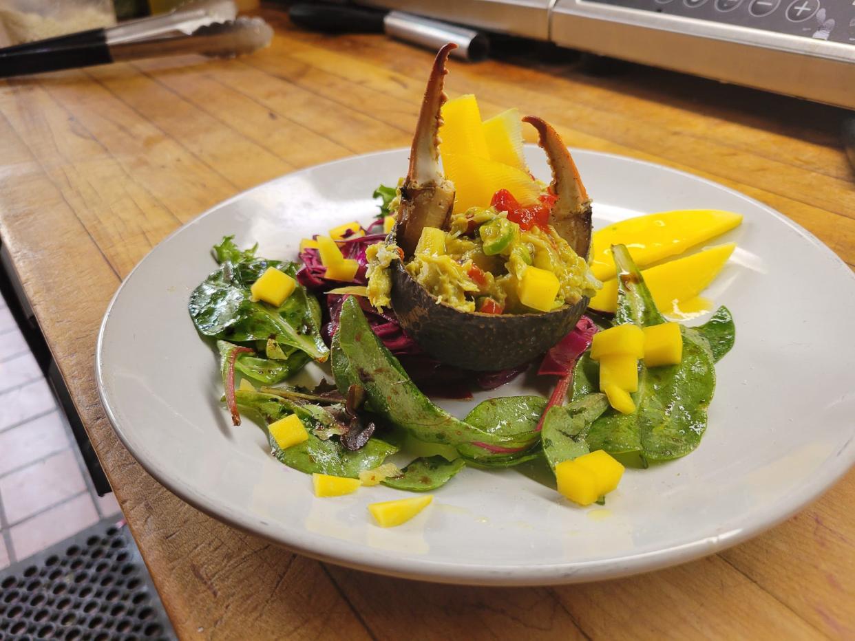 Crab Martinique from Shaker's Cigar Bar in Milwaukee is made with crabmeat, avocado, mango and roasted red peppers. The green and gold appetizer is perfect for a Packers game day.