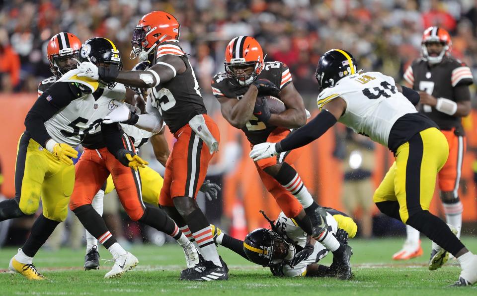 Browns running back Nick Chubb pushes through an opening during the second half against the Steelers, Thursday, Sept. 22, 2022, in Cleveland.