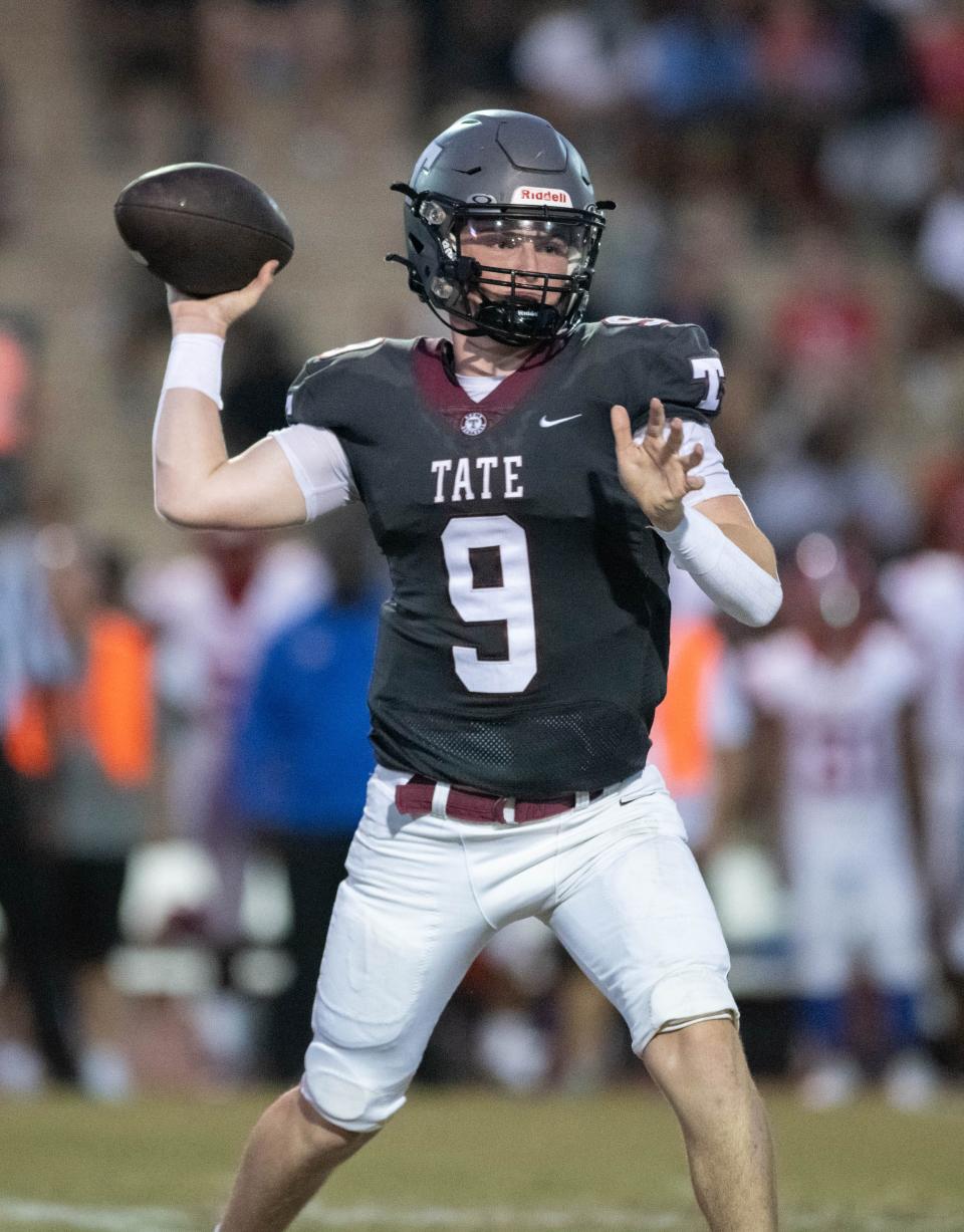 Quarterback Taite Davis (9) gets set to pass during the Pine Forest vs Tate football game at Tate High School in Cantonment on Friday, Aug. 25, 2023.