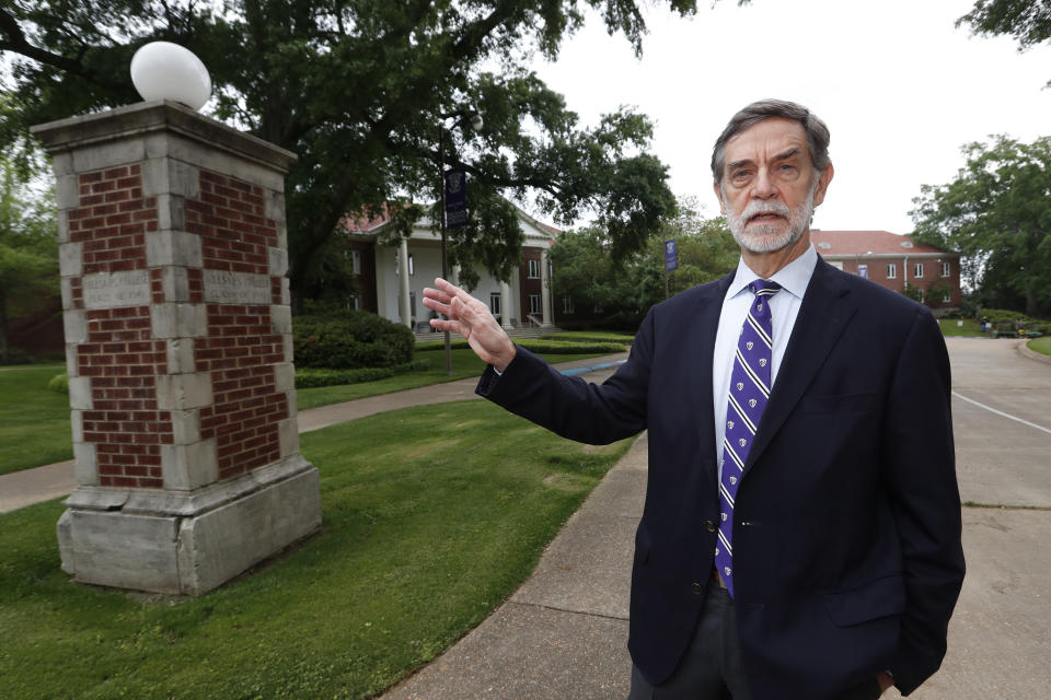 Millsaps College president Robert W. Pearigen speaks about the history of some of the buildings at the small liberal arts college in Jackson, Miss., Friday, April 3, 2020. With students online learning in face of the coronavirus, Pearigen and other small college leaders face an unusual set of financial and enrollment challenges because of the virus. (AP Photo/Rogelio V. Solis)