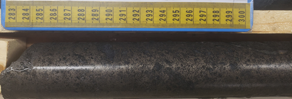 Plate 1 - 2021-07-14: Net texture pyrrhotite – pyrite ± sphalerite ± chalcopyrite mineralization observed in hole KF21023 (74.0m)