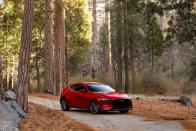 <p>Small sedans are the hot-dog fingers of the car-design world: stubby, inelegant, and uglier the longer you look. The 3 combats this with a low and relatively long trunk and a handsome nose.</p>
