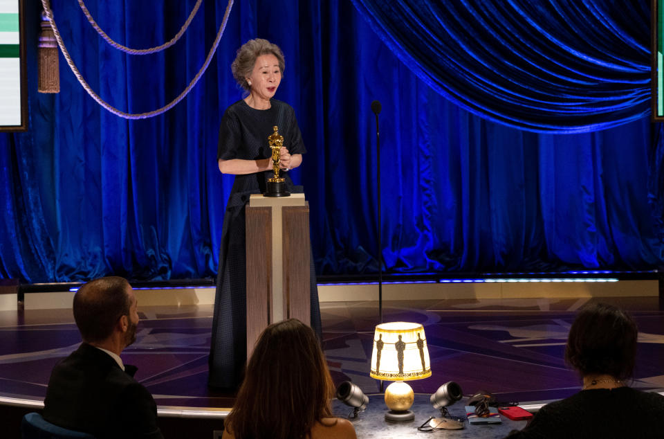 LOS ANGELES, CALIFORNIA – APRIL 25: (EDITORIAL USE ONLY) In this handout photo provided by A.M.P.A.S., Yuh-Jung Youn accepts the Oscar for Best Actress in a Supporting Role for 