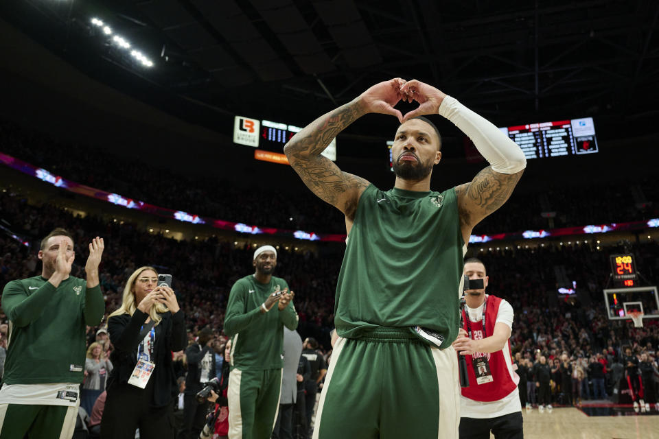 Jan 31, 2024; Portland, Oregon, USA; Milwaukee Bucks guard Damian Lillard (0) shows his love for Portland fans during introductions before a game against the Portland Trail Blazers at Moda Center. Mandatory Credit: Troy Wayrynen-USA TODAY Sports