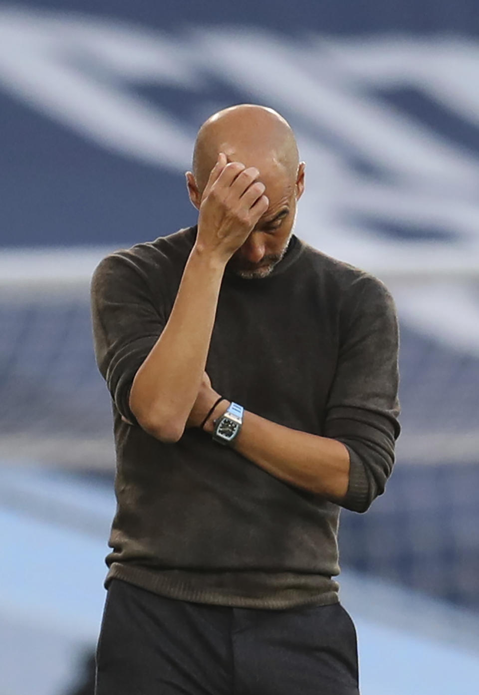 Manchester City's head coach Pep Guardiola reacts after Leicester scored their 4th goal of the game during the English Premier League soccer match between Manchester City and Leicester City at the Etihad stadium in Manchester, England, Sunday, Sept. 27, 2020. (Catherine Ivill/Pool via AP)